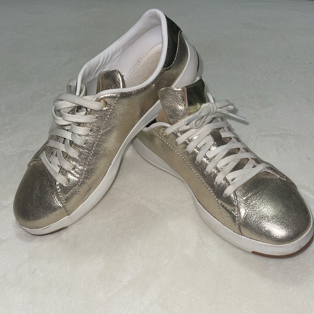 Unique Cole Haan gold grandprø lace up sneakers.  Very comfy and cute.